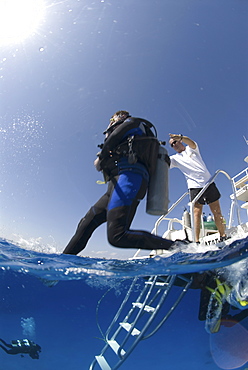 Technical Divers using Trimix, entering water from dive boat, Divetech, Grand Cayman, Cayman Islands, Caribbean