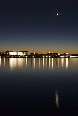 New moon above Australian National Library and Lake Burley Griffin, Canberra, Australian Capital Territory, Australia