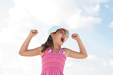 Girl at beach making funny face