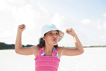 Girl at beach making funny face