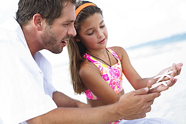 Daughter showing starfish to father