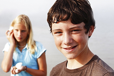 Friends looking for shells on beach