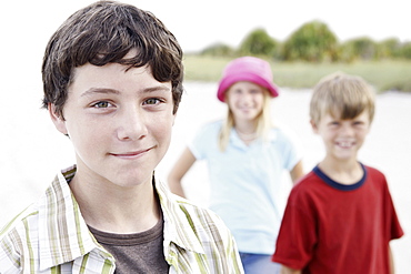 Children posing on beach