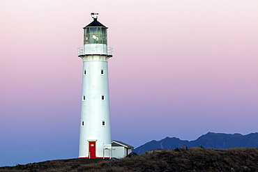 Lighthouse with Taranaki volcano in background, New Zealand