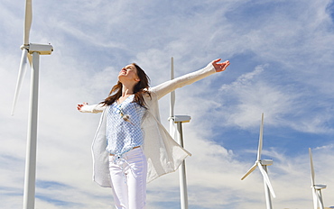 Young woman at wind farm
