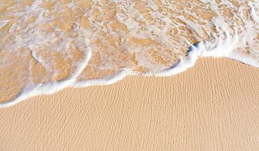 Sea waves on beach sand