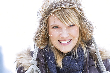 Portrait of woman wearing knit hat smiling