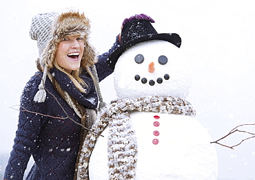 Portrait of woman with snowman