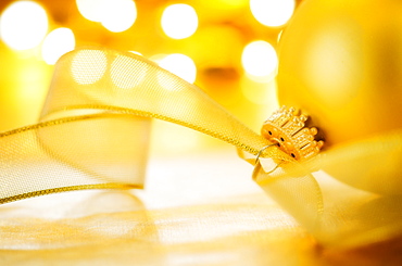 Close-up of Christmas ball with ribbon, studio shot