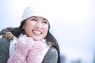 Portrait of happy woman wearing warm clothing
