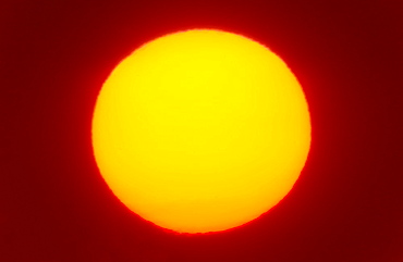 Close-up of large red sun