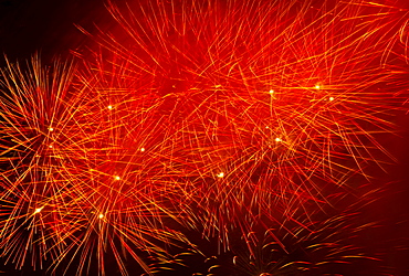 Fireworks explosion against night sky