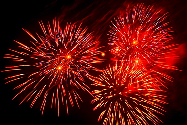 Fireworks explosion against night sky