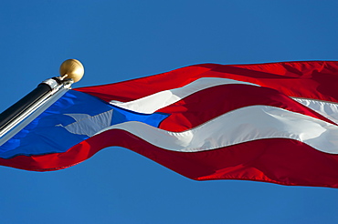 Puerto Rico, Old San Juan, Close up of Puerto Rican flag against blue sky