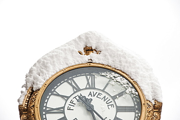 USA, New York, New York City, close up of antique clock covered with snow