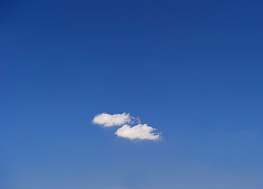 Single cloud in blue sky