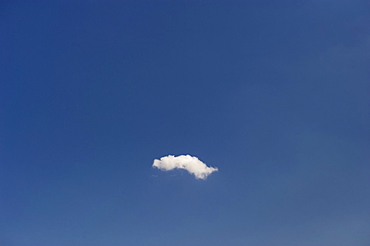 Single cloud in blue sky