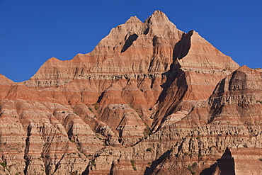 USA, South Dakota, Mountain against blue sky in Badlands National Park