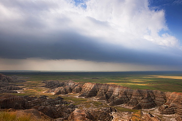 USA, South Dakota, Thick gray clouds over mountains in Badlands National Park