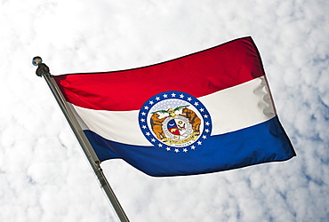 USA, Missouri State flag against sky