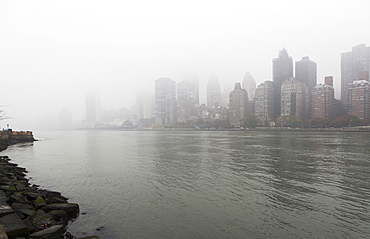 View of city over river, USA, New York State, New York City