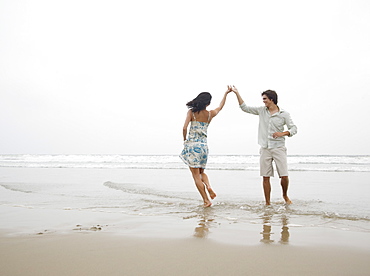 Couple dancing at beach