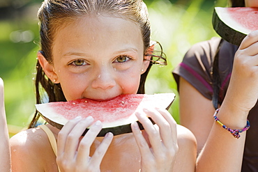 Girls eating watermelon