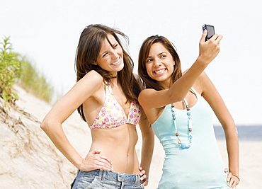 Young women taking own photograph