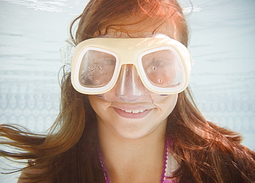 USA, New York, Girl (10-11 in swimming pool