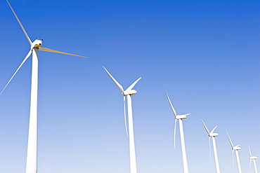 USA, California, Palm Springs, Coachella Valley, San Gorgonio Pass, Wind turbines against blue sky