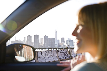 USA, Brooklyn, Williamsburg, Woman driving through city