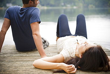 Roaring Brook Lake, Couple lying on pier
