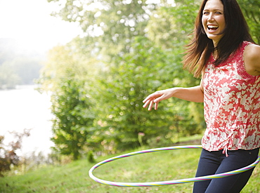 Roaring Brook Lake, Woman plying with hoopla hoop