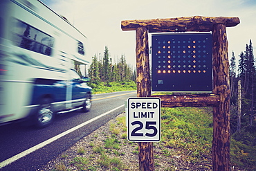 Motor home passing 25 mph speed limit sign, RCedar Breaks National Monument, Utah