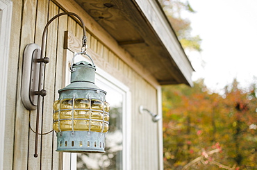 Close up of lantern on wooden hut