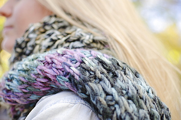 Woman wearing knit scarf