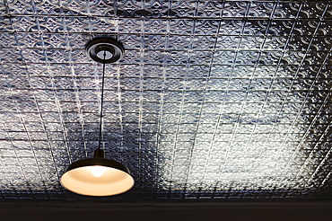 Pendant lamp on tiled ceiling