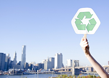 USA, New York State, New York City, Manhattan, Hand holding recycling symbol