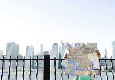 USA, New York State, New York City, Brooklyn, Woman holding map