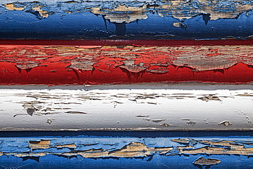 Red, white and blue peeling paint