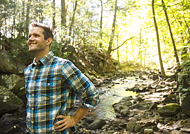 Man standing in forest, Newtown, Connecticut