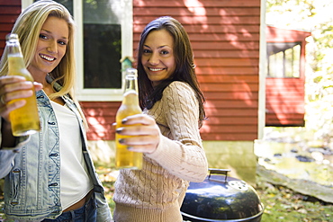 Two women enjoying barbecue, Newtown, Connecticut