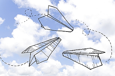 Paperplanes drawn on cloudy sky