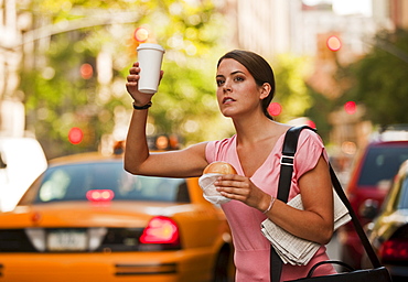 Woman hailing cab