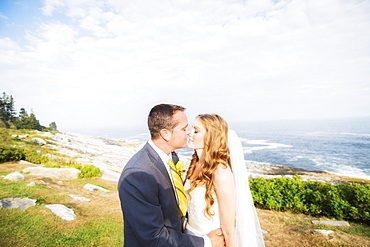 Portrait of married couple kissing, USA, Maine, Bristol 