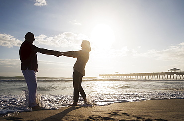 Senior couple dancing on beach, Jupiter, Florida
