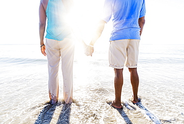 Mature couple standing in sea