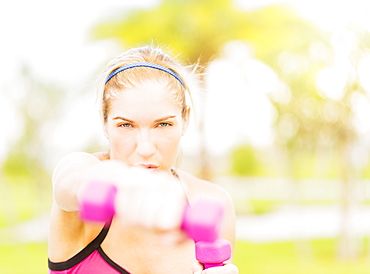 Young woman exercising in park, Jupiter, Florida