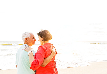 Older couple spending time together on beach, Jupiter, Florida