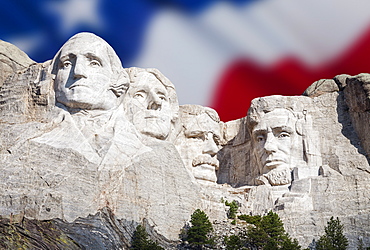 Mount Rushmore National Memorial with American flag in the background, USA, South Dakota, Black Hills, Mount Rushmore National Memorial